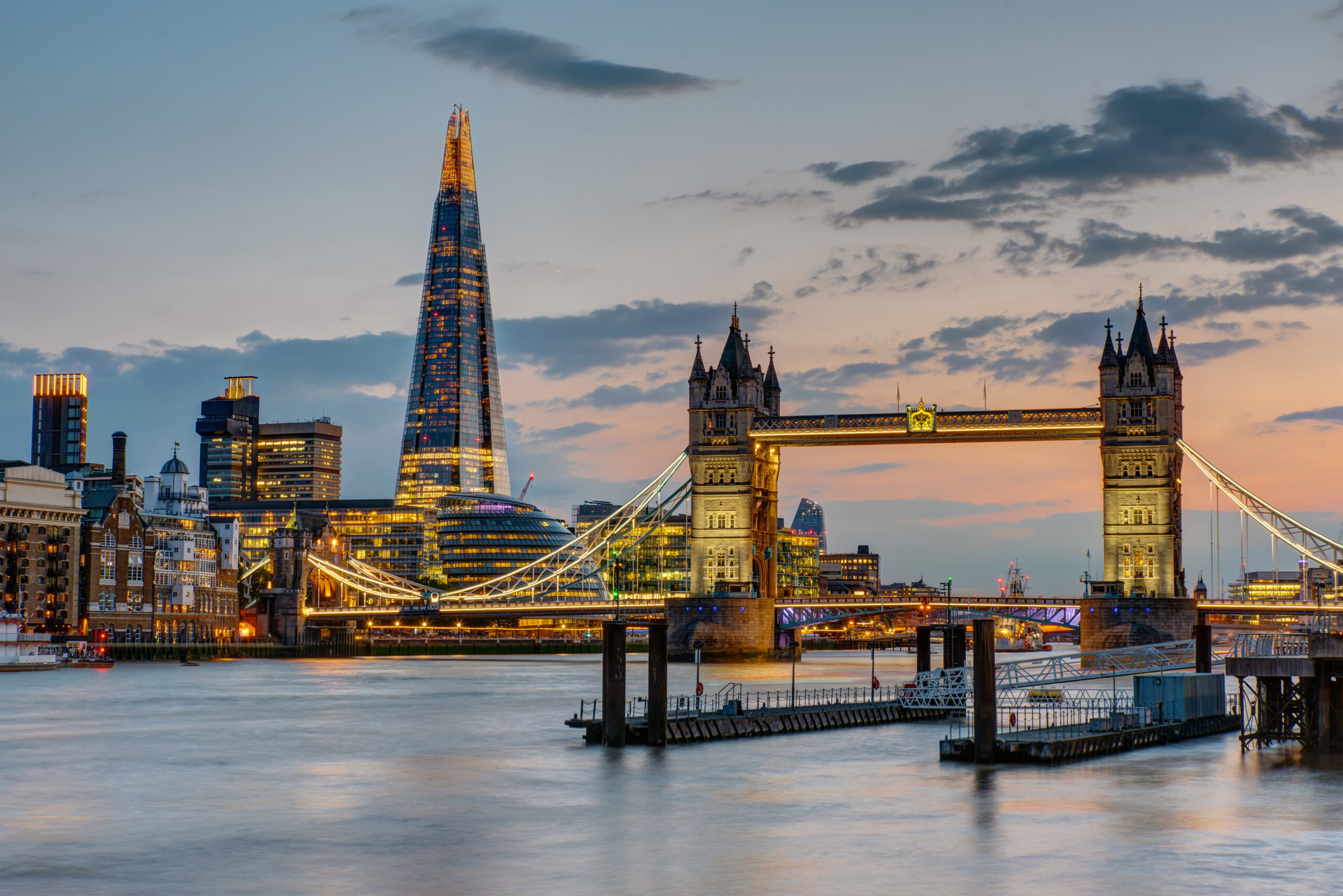 The Tower Bridge in London after sunset with the Shard in the ba